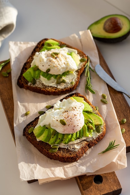 Two sandwiches with avocado and egg for breakfast