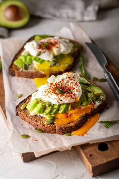 Two sandwiches with avocado and egg for breakfast