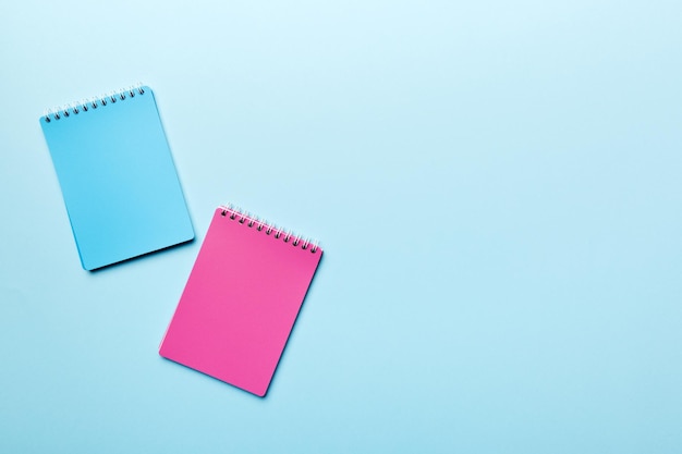 Two school colored notebook on a desk background spiral craft notepad on a table Top view