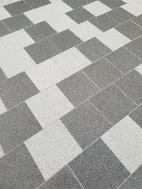 A two shades of grey tile flooring in random pattern