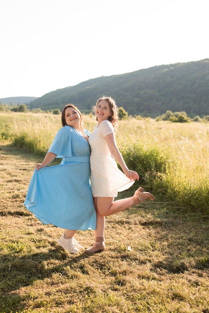 Two sisters hugging each other at the farm