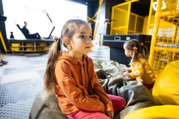 Two sisters playing at kids play center