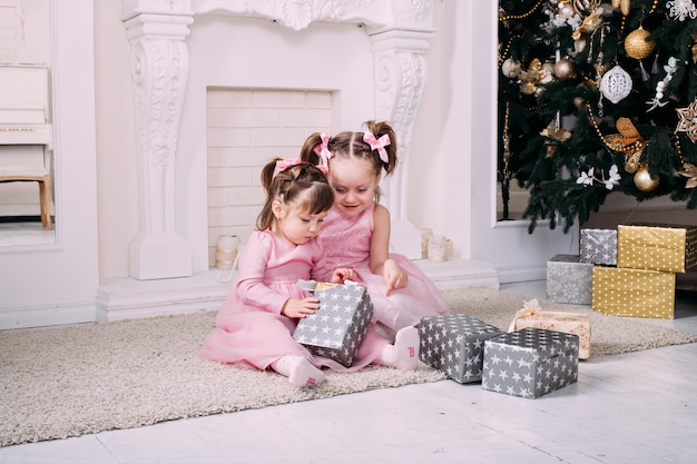 Two sisters with Christmas presents