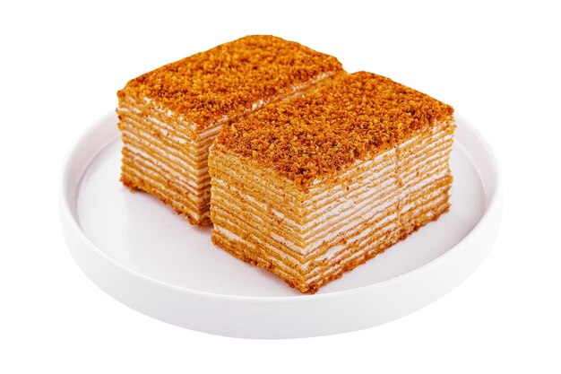 Two sliced honey cake on plate