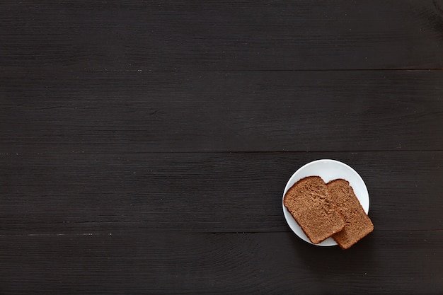 Two slices of bread on a white plate