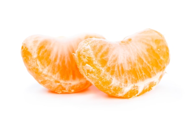 Two slices of mandarin isolated on white background