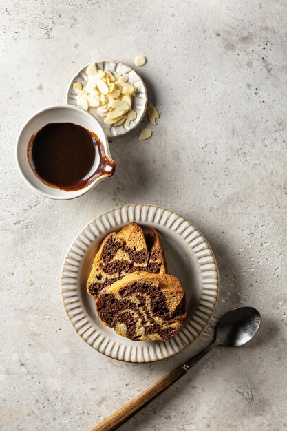 Two slices of zebra cake on a plate, top view, copy space, isolated