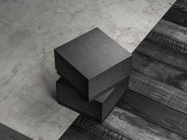 Two Square textured paper black boxes mockup on the concrete floor, 3d rendering