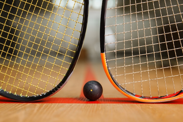 Two squash rackets and ball, game concept