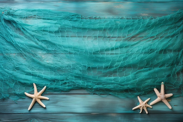 Photo two starfish and a green fishing net on a blue wooden background