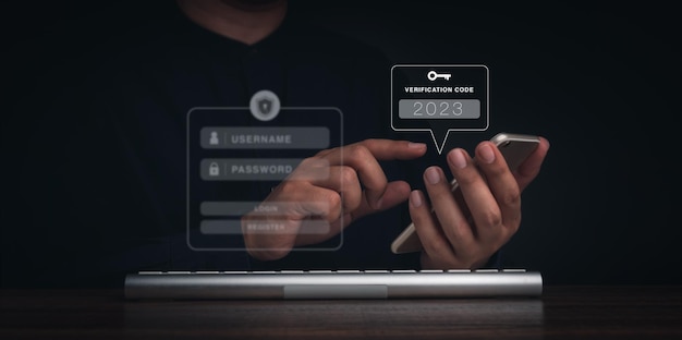 Two steps authentication or 2FA concept 2023 Verification code and key icon on smart phone screen with keyboard computer for validate password page Identity verification cyber security technology