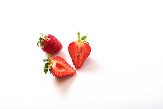 Two strawberries isolated on white background inside view Sliced strawberries half a berry