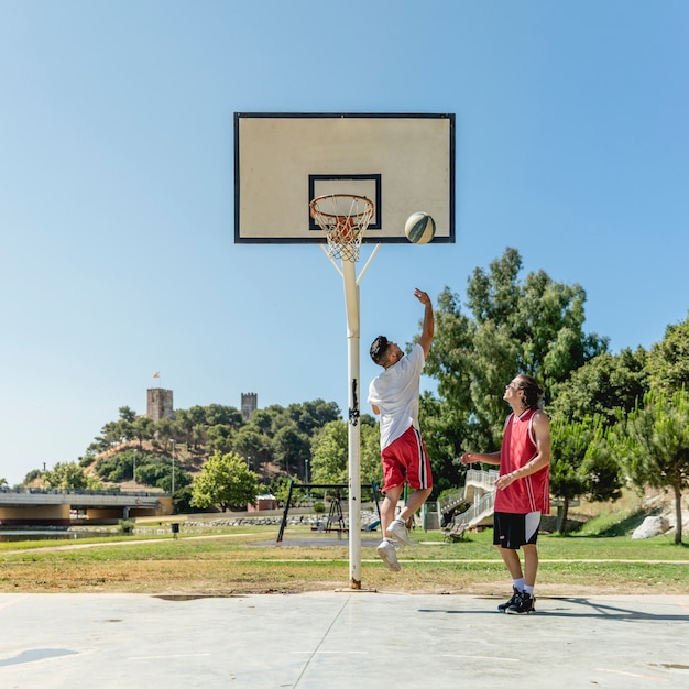 Two street player playing basketball