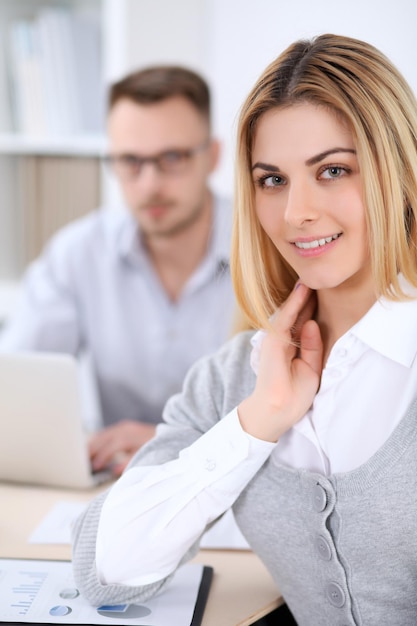 Two successful business partners working at meeting in office.