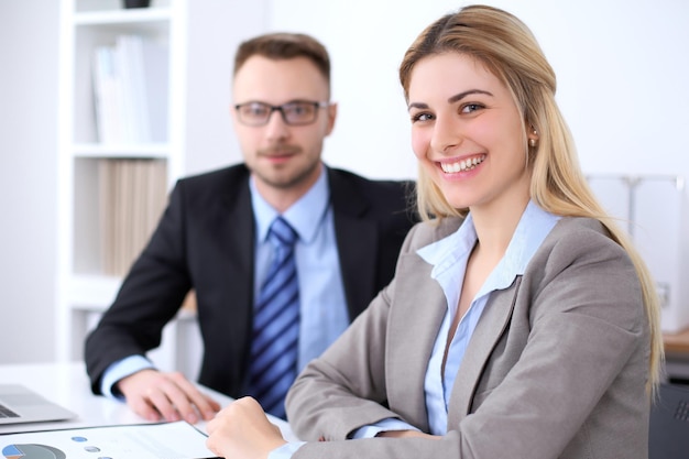 Two successful business partners working at meeting in office.