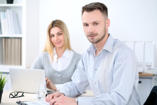 Two successful business partners working at meeting in office.