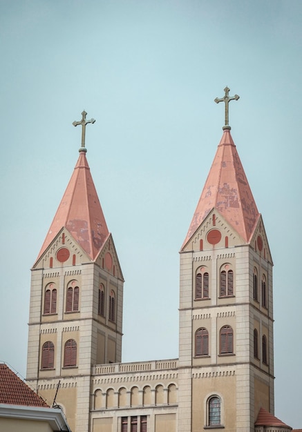 Two towers with crosses on them, one of which says " st. francis ".