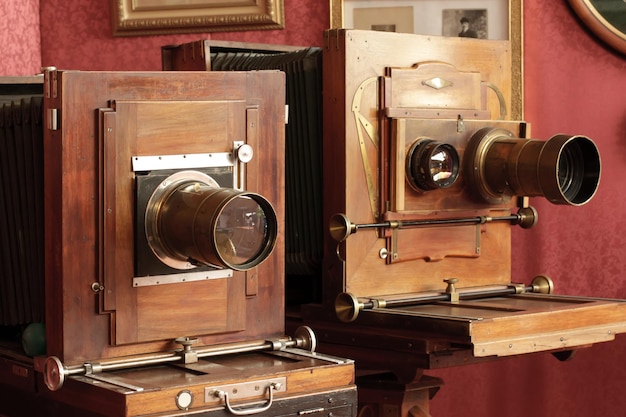 Two vintage cameras with lenses