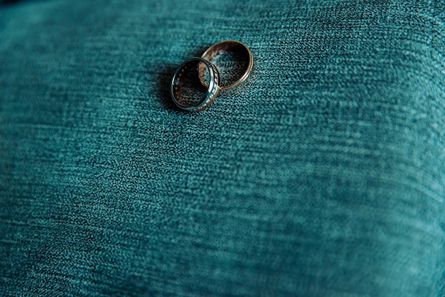 Two wedding rings on the floor with contrast