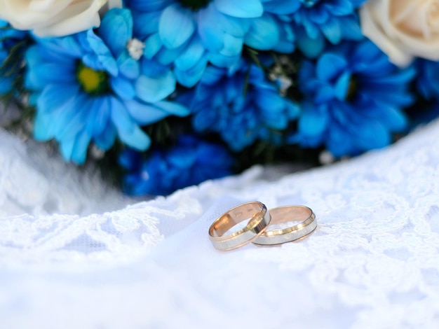 Two wedding rings and flowers