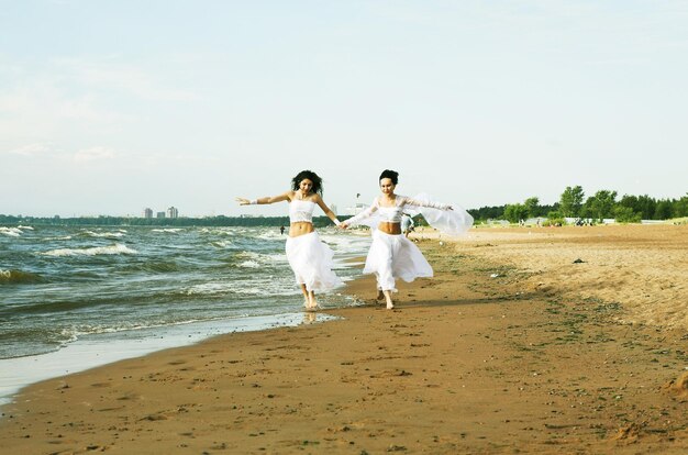 Two white angels on the beach