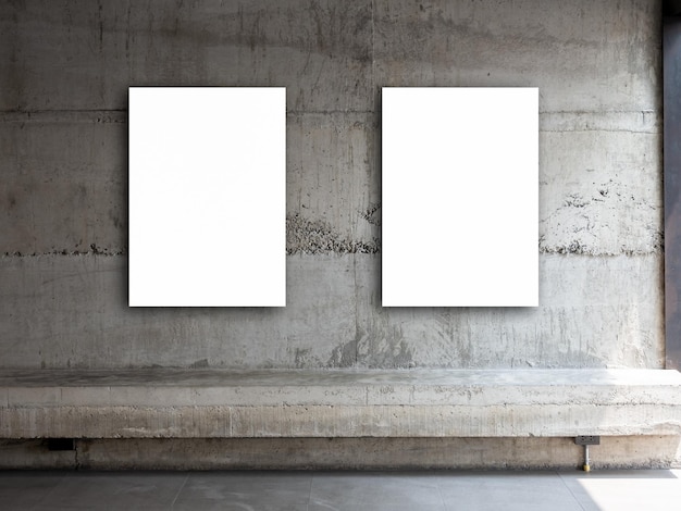 Two white blank rectangle picture frames vertical style Couple empty square artist canvas space hanging on concrete wall background over empty cement long bench seat