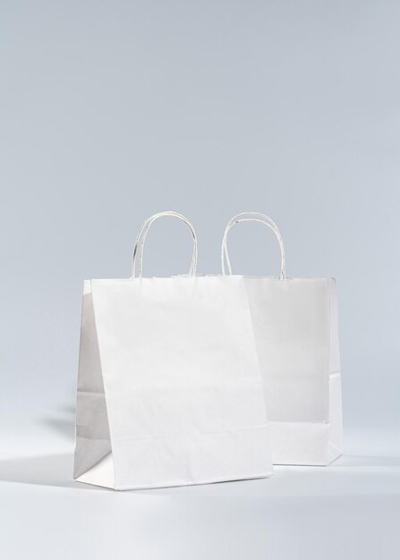 Two white craft bags on a light background