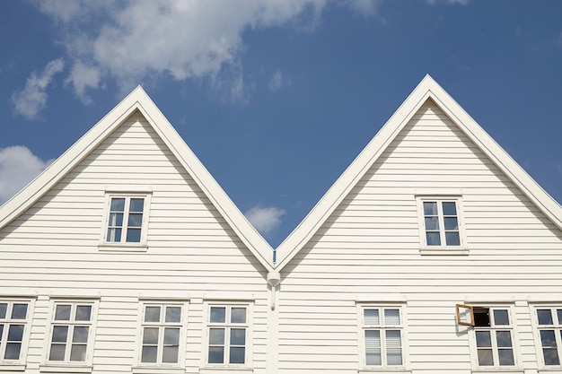 Two white wooden houses