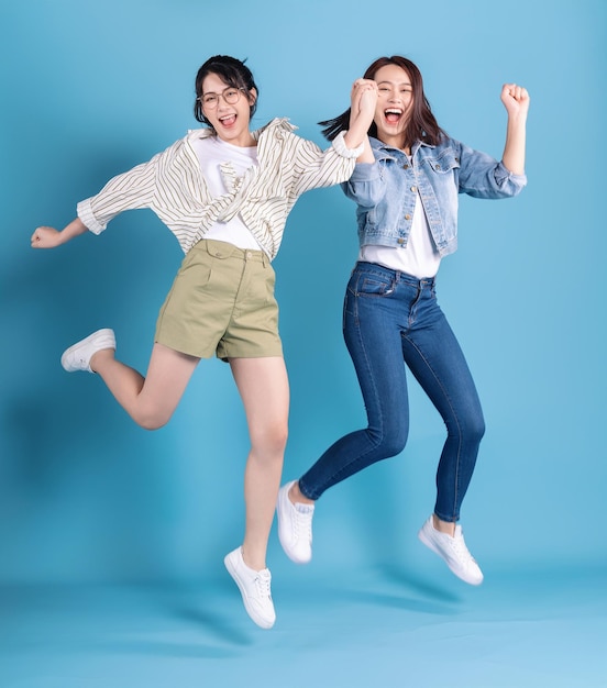 Two women on blue background