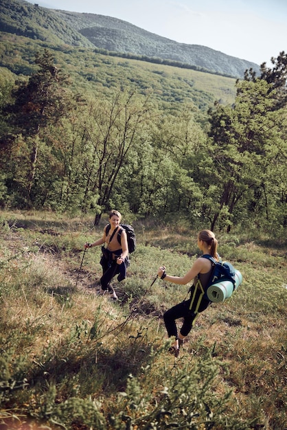 Two Women Hiking On Mountain