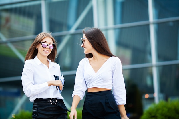 Two women near the airport go on a plane