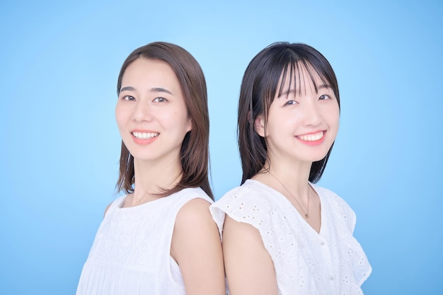 Two women in white clothes