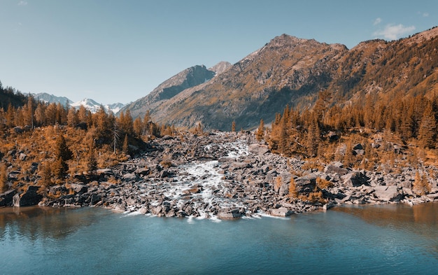 Two wonderful mountain lakes connected by a stream channel with a rapid Water recreation and wildlife nature concept