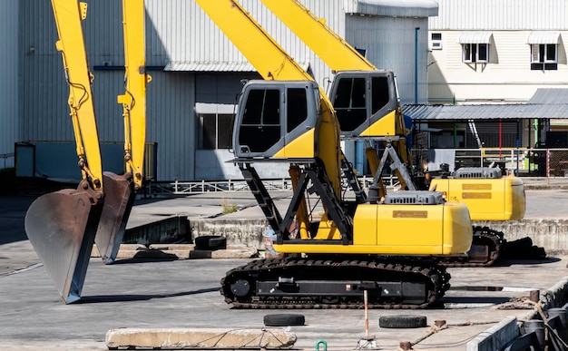 Two yellow backhoe on dock