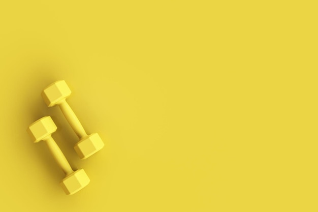 Two yellow fitness dumbbells on yellow background