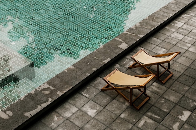 Two yellow hammock beach near swimming pool