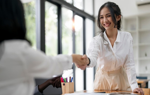 Two young Businesswoman handshake and business people Successful business concept