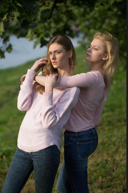 Two young girls hug