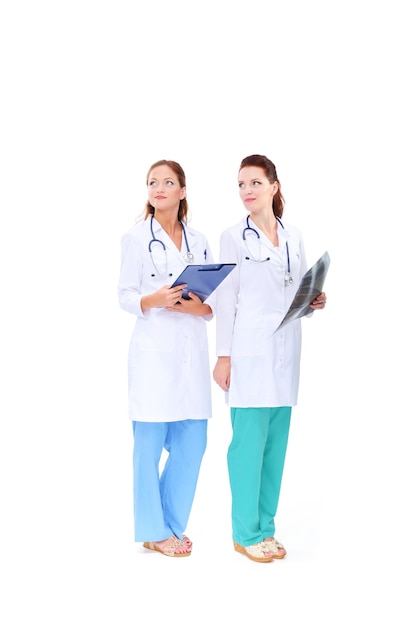 Two young woman doctor standing in hospital