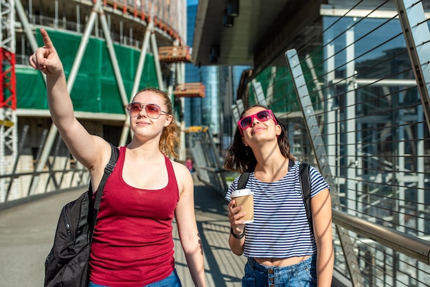 Two young women travelling in the city summer tourism for college students