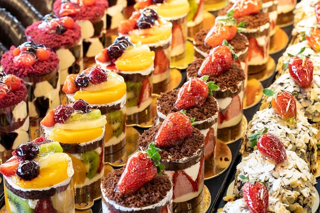 Types of cakes Cakes on display at the patisserie counter close up