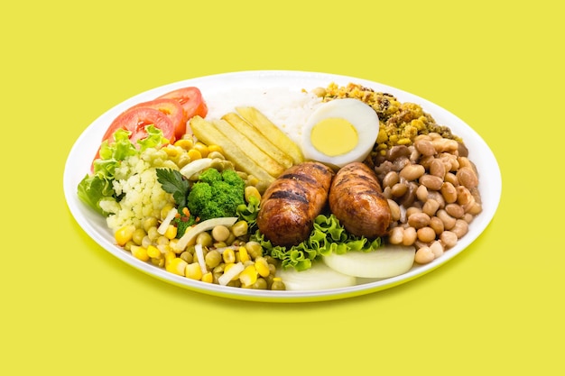 Typical brazilian meal rice and beans tomato salad boiled egg and french fries called a traditional dish or executive dish