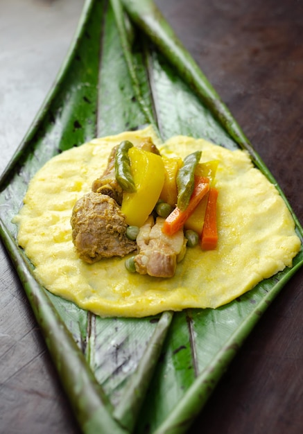 Photo typical colombian and mexican traditional dish made with corn dough and stuffed with chicken pork