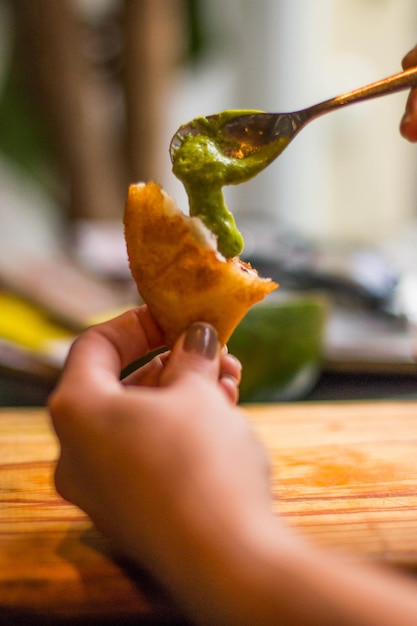 Typical empanadas of Venezuelan gastronomy with vegetables and sauce