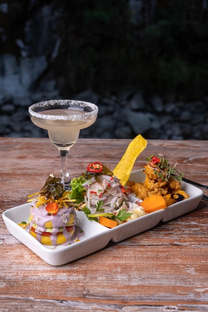 Typical food of Peru, white fish ceviche. at the table of a Peruvian restaurant.