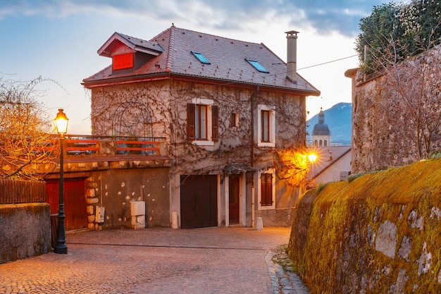 Typical french houses in old town of annecy during morning blue hour france