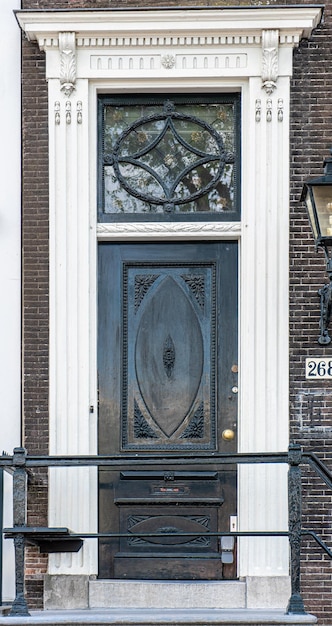 Typical house entrance with door windows in the old town of Amsterdam Netherlands