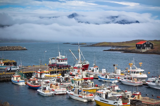 Photo typical iceland harbor with fishing boats