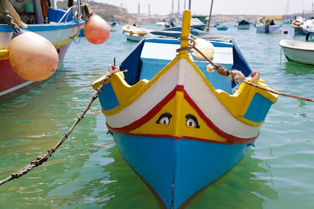 Typical maltese fishing boat called luzzu with the eye of Osiris in Marsaxlokk Malta