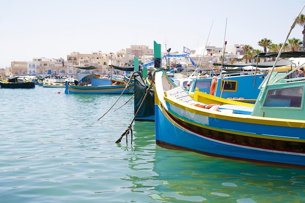 Typical maltese fishing boats called luzzu with the eye of Osiris in Marsaxlokk Malta